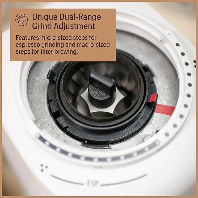 The top bean hopper removed, showcasing the specialized burr assembly for consistent grinding.