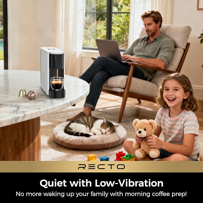 White espresso maker brewing a rich shot of espresso into a small cup.